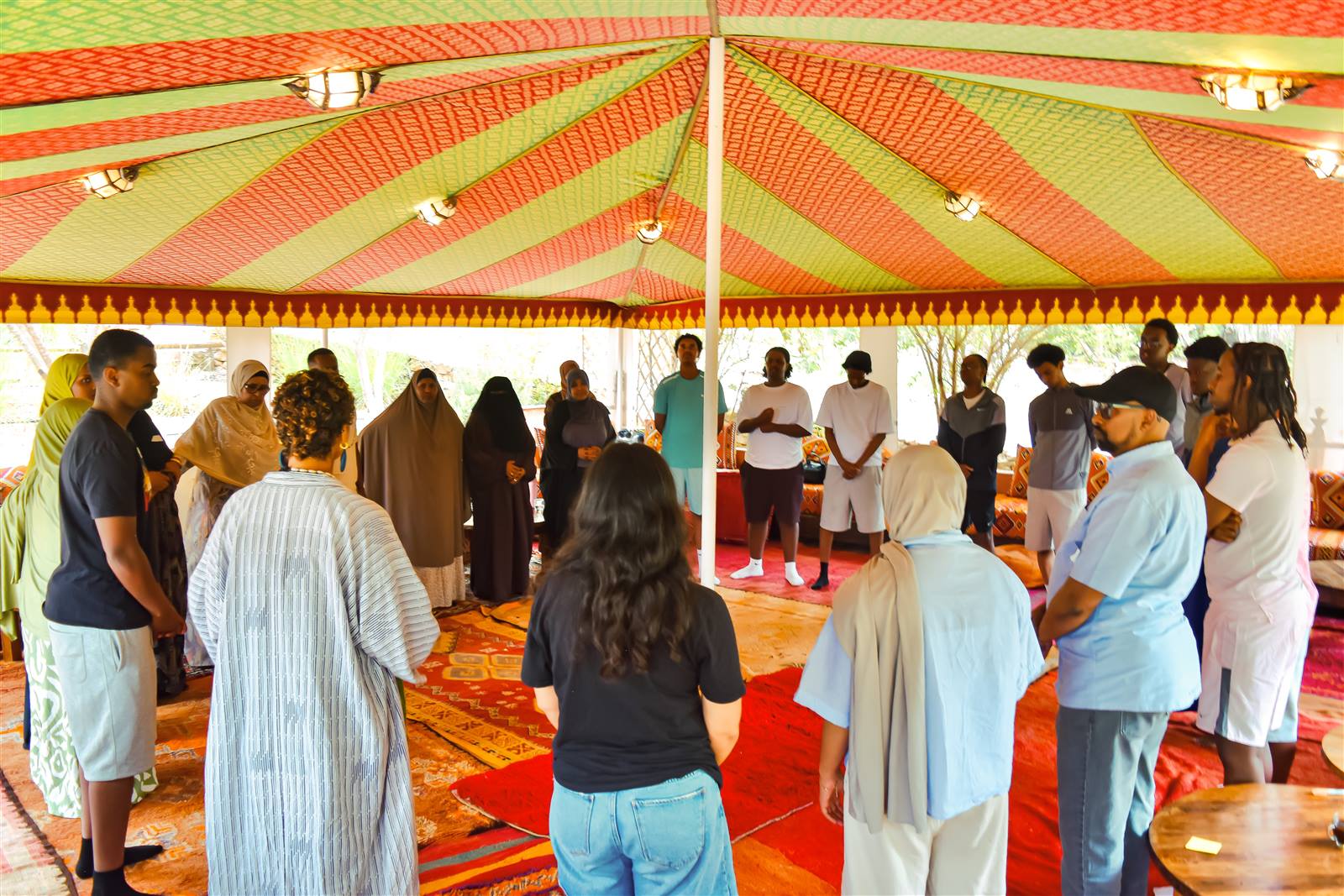 Coffee Afrik community members standing in a circle at a leadership retreat